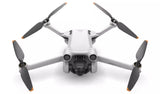DJI Mini 3 Pro Drone in flight showcasing compact design, 4K camera, and obstacle avoidance sensors.