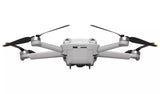 DJI Mini 3 Pro Drone in flight showcasing compact design, 4K camera, and obstacle avoidance sensors.