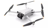 DJI Mini 3 Pro Drone in flight showcasing compact design, 4K camera, and obstacle avoidance sensors.