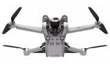 DJI Mini 3 Pro Drone in flight showcasing compact design, 4K camera, and obstacle avoidance sensors.