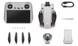 Complete DJI Mini 3 Pro Drone package including remote controller, batteries, propellers, charging hub, and carrying case.