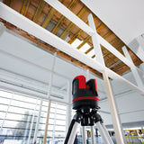 image of a leica disto 3d being used to get a couple of measurements inside of a warehouse