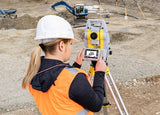 image of a geomax zoom95 robotic total station that is being used on a construction site