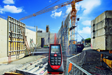 image of a leica disto d510 laser measuring tape being used on a construction site